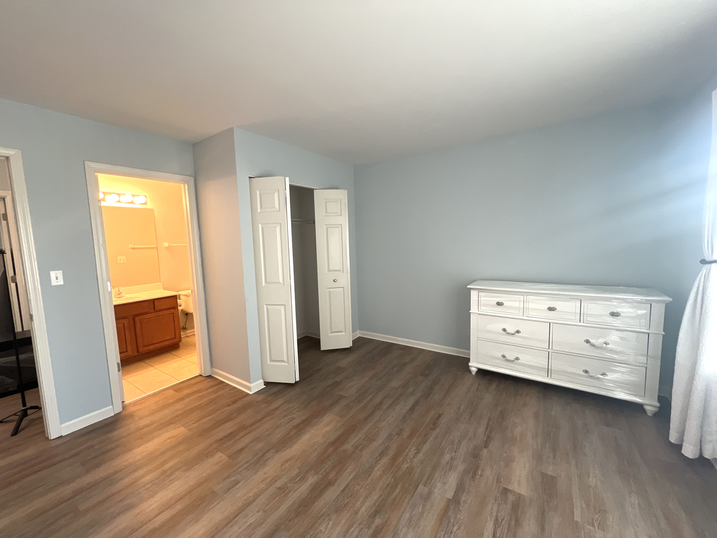 669 South Rosehall Lane, Unit 669 Round Lake, IL 60073 - Photo 13 of 17 a view of a room with wooden floor