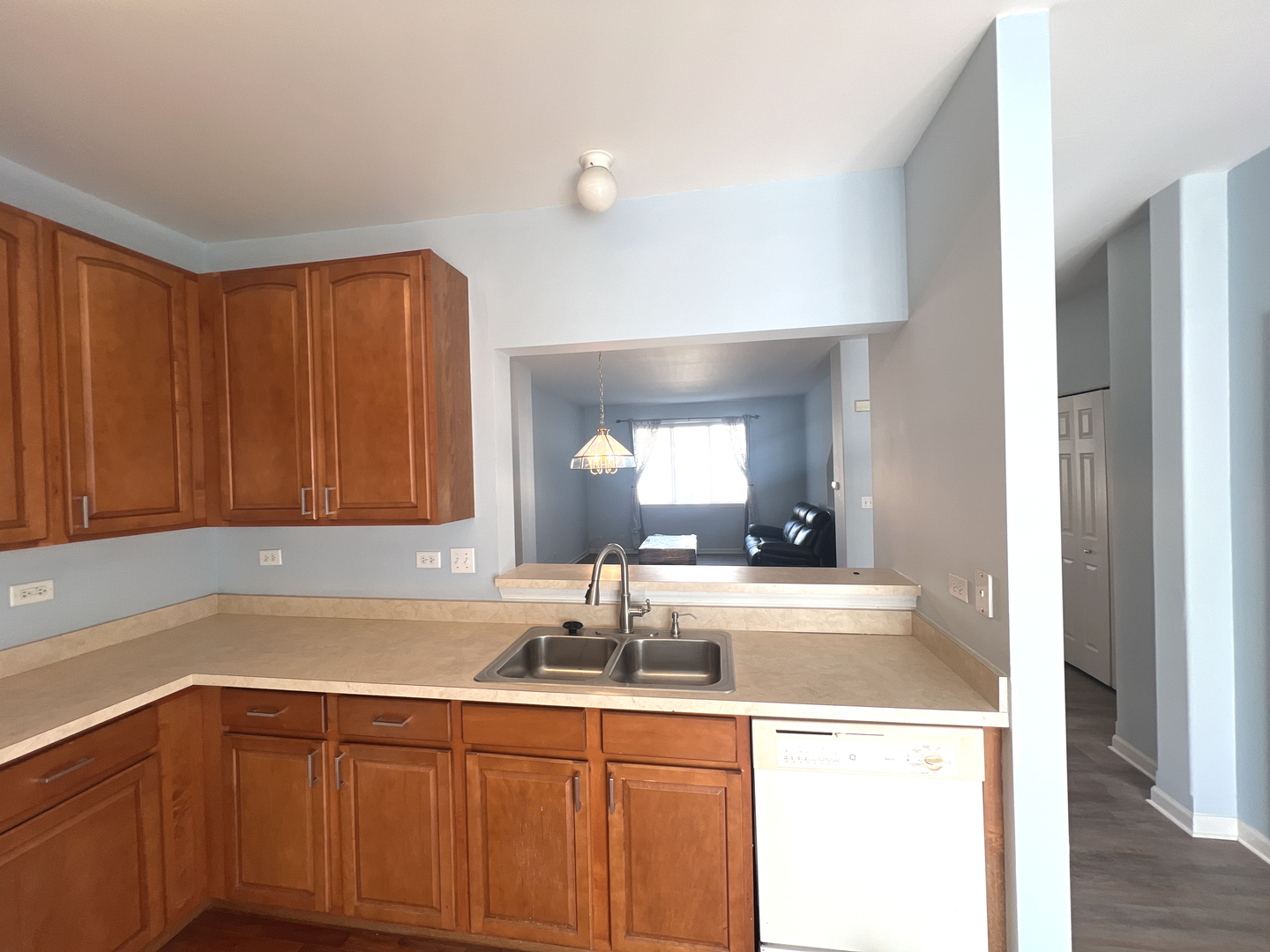 669 South Rosehall Lane, Unit 669 Round Lake, IL 60073 - Photo 5 of 17 a kitchen with a sink and cabinets