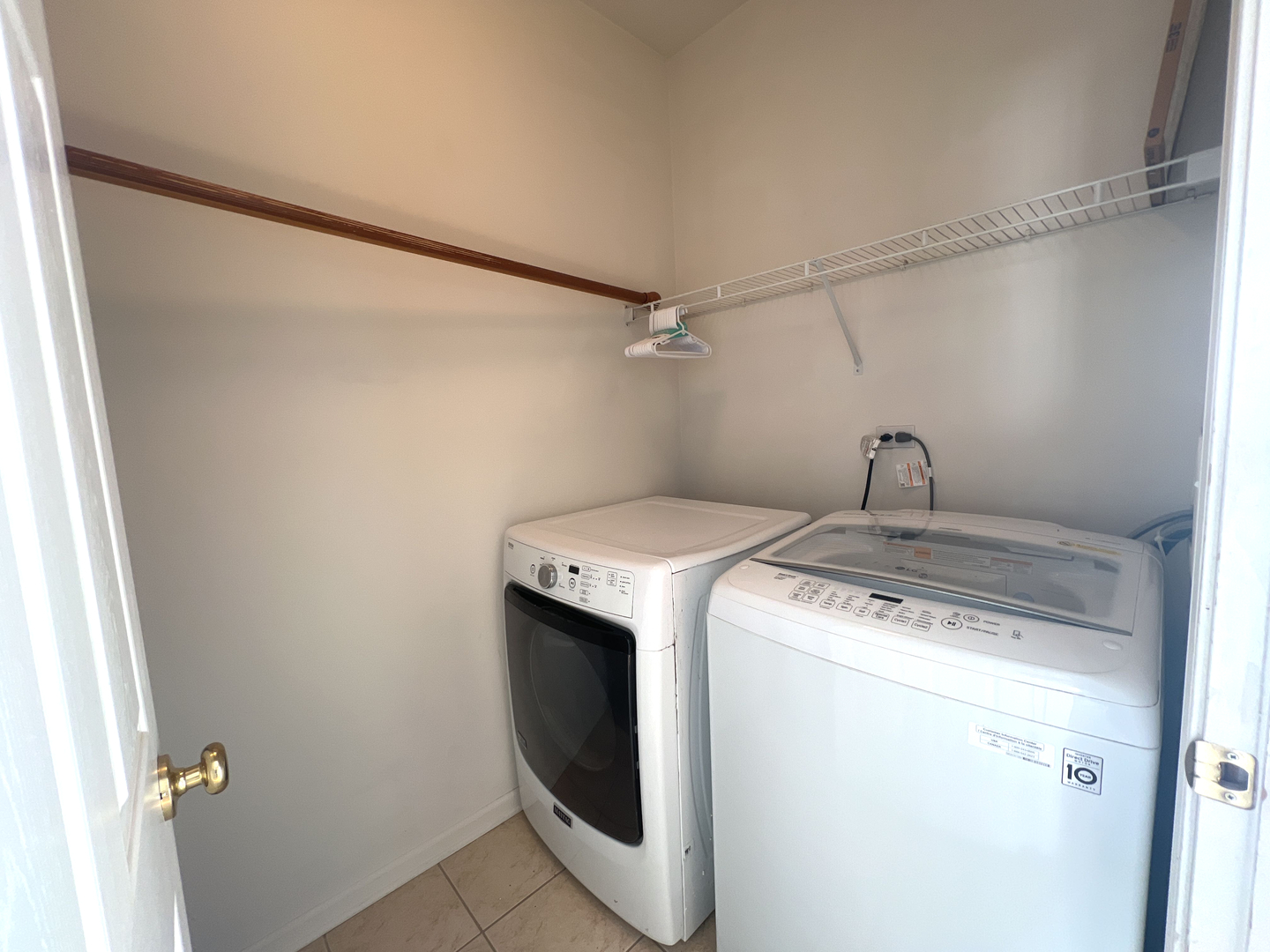 669 South Rosehall Lane, Unit 669 Round Lake, IL 60073 - Photo 8 of 17 a utility room with dryer and washer