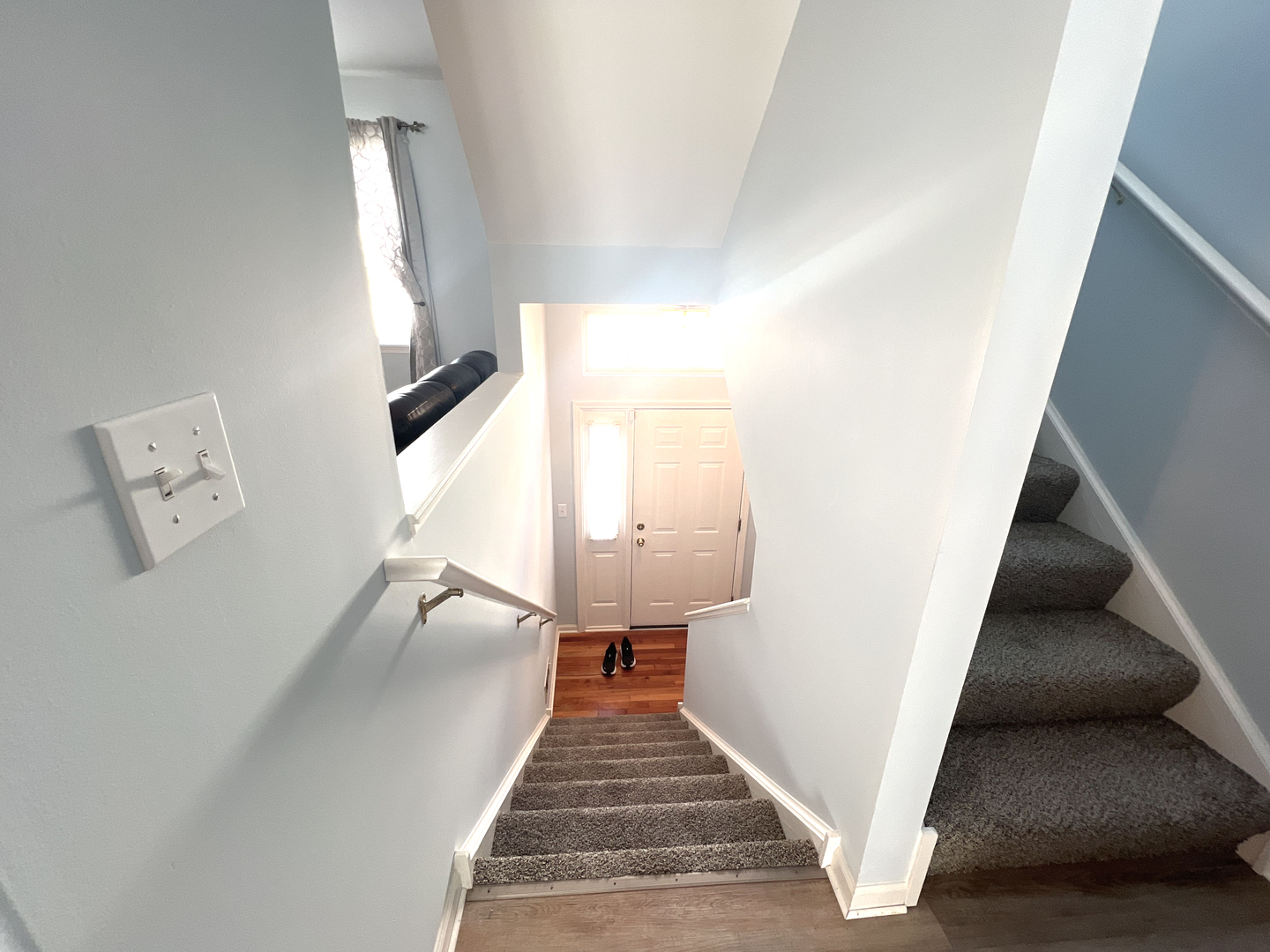 669 South Rosehall Lane, Unit 669 Round Lake, IL 60073 - Photo 9 of 17 a view of entryway and hall with wooden floor