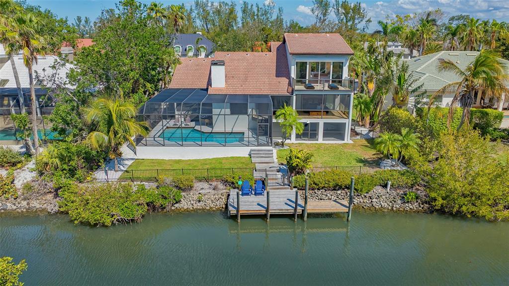 3151 Bayou Sound Longboat Key, FL 34228 - Photo 52 of 68 an aerial view of a house with swimming pool and outdoor space