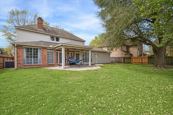 a view of a backyard with sitting area and slide