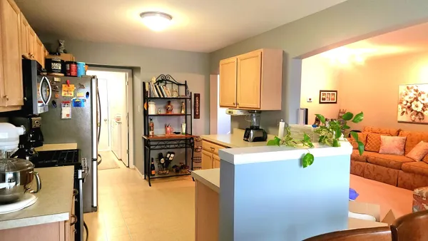 a kitchen with a sink cabinets and window