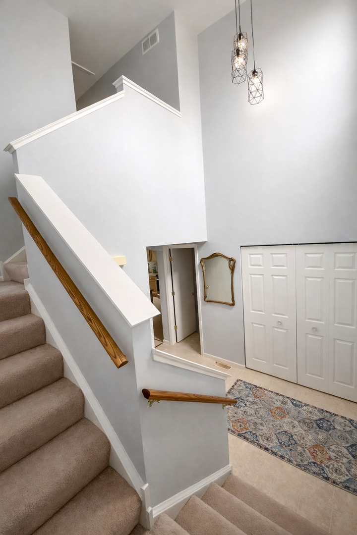 25734 Bridle Path Channahon, IL 60410 - Photo 17 of 29 a view of staircase with white walls and railing
