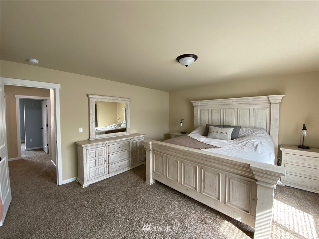9235 179th Trail Southwest Rochester, WA 98579 - Photo 17 of 38 a bedroom with a bed and cabinets