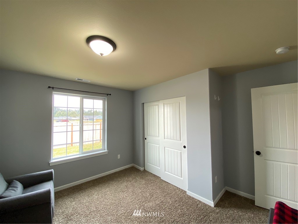 9235 179th Trail Southwest Rochester, WA 98579 - Photo 23 of 38 a view of an empty room with a window