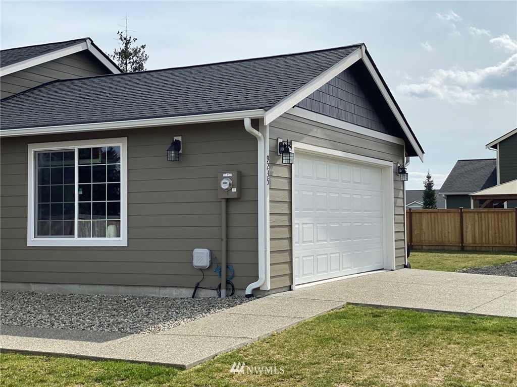 9235 179th Trail Southwest Rochester, WA 98579 - Photo 27 of 38 a front view of a house with garden