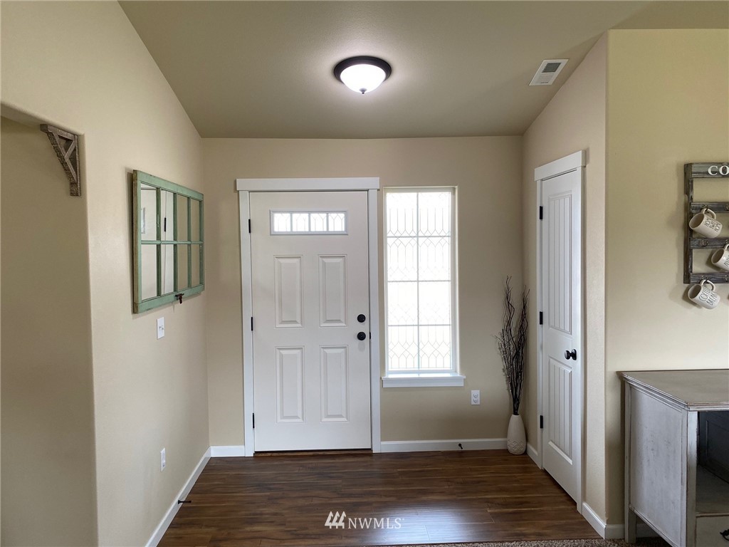 9235 179th Trail Southwest Rochester, WA 98579 - Photo 4 of 38 a view of an entryway with wooden floor