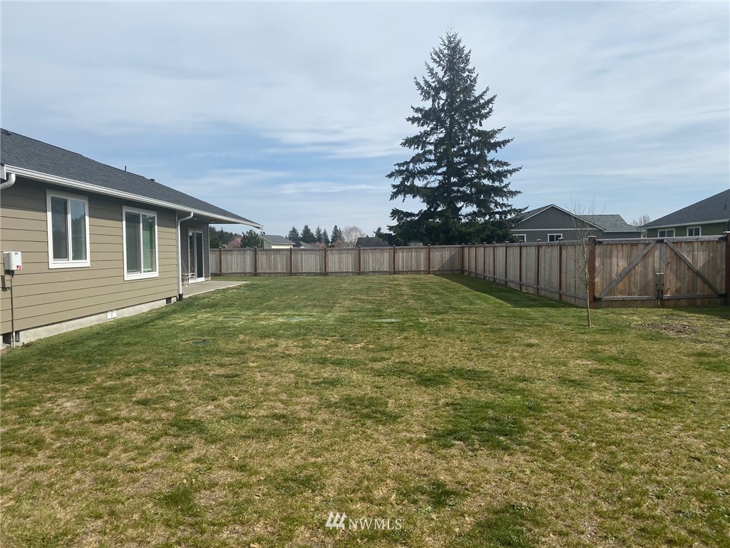 9235 179th Trail Southwest Rochester, WA 98579 - Photo 33 of 38 a view of a backyard with a garden
