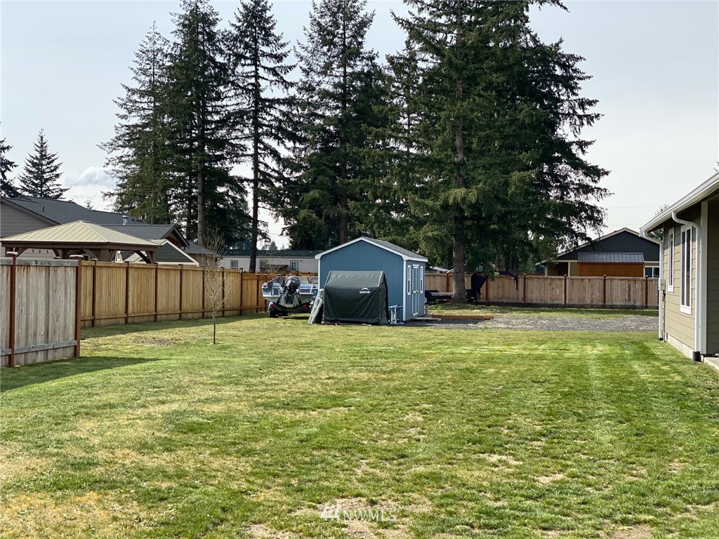 9235 179th Trail Southwest Rochester, WA 98579 - Photo 35 of 38 a house with a yard in front of it