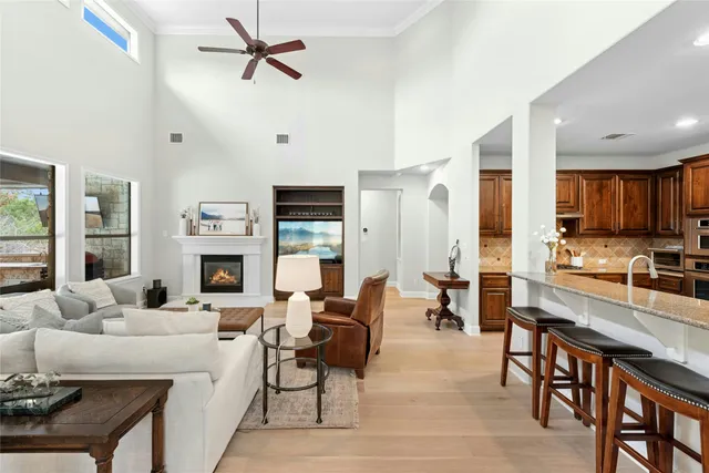 a living room with furniture fireplace and a view of kitchen