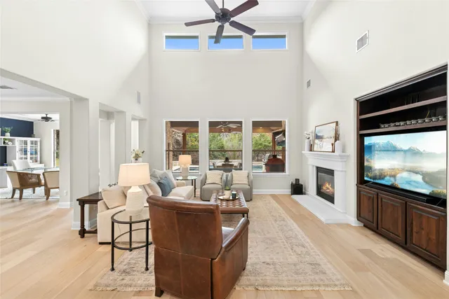 a living room with furniture tv and a fireplace