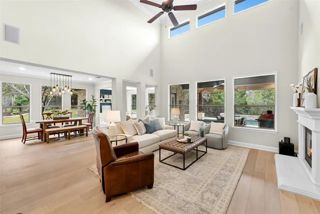 a living room with furniture and a table with wooden floor