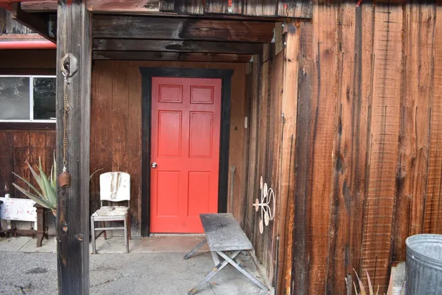 a view of front door with chair and door