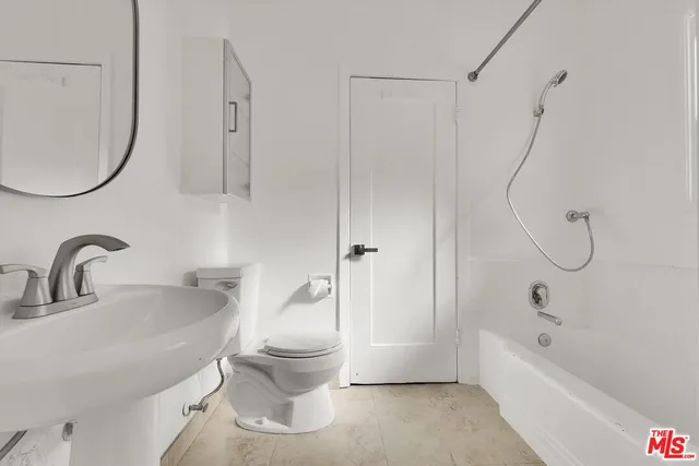 a bathroom with a sink a toilet and a bathtub