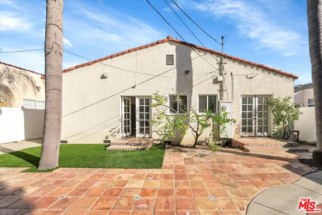 a front view of a building with garden