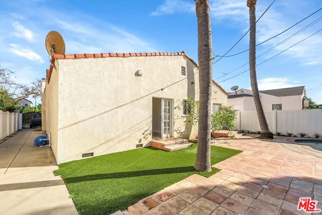 a front view of a building with garden