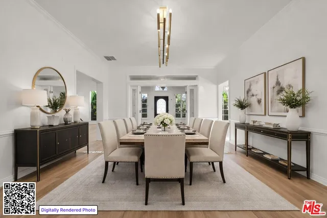 a dining room with wooden floor a chandelier a wooden table and chairs