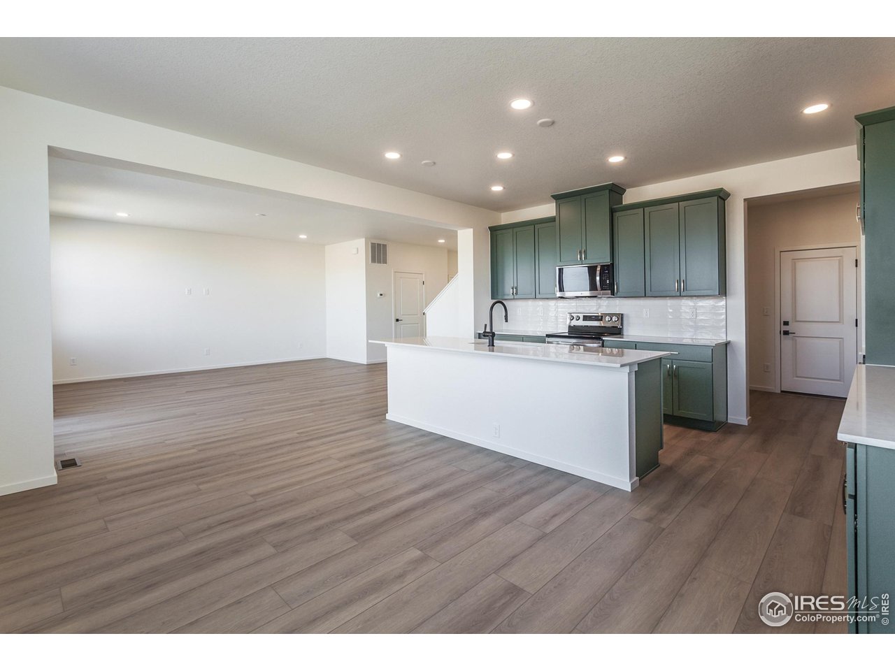 6108 Gault Road Timnath, CO 80547 - Photo 6 of 44 DINING, KITCHEN AND LIVING ROOM
