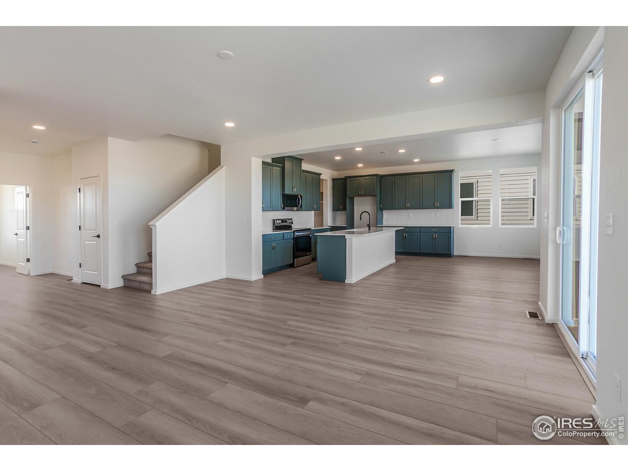 6108 Gault Road Timnath, CO 80547 - Photo 7 of 44 LIVING ROOM AND KITCHEN