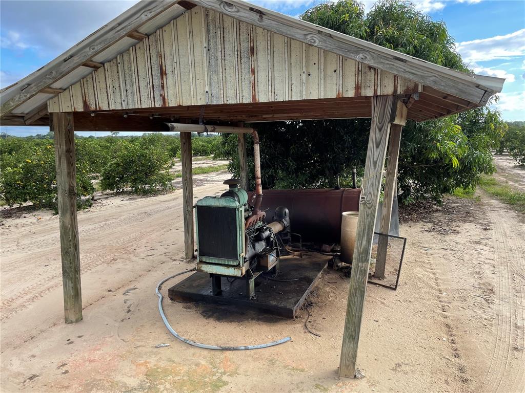 Lawrence Stewart Road Frostproof, FL 33843 - Photo 13 of 13 a view of a patio with table and chairs under an umbrella