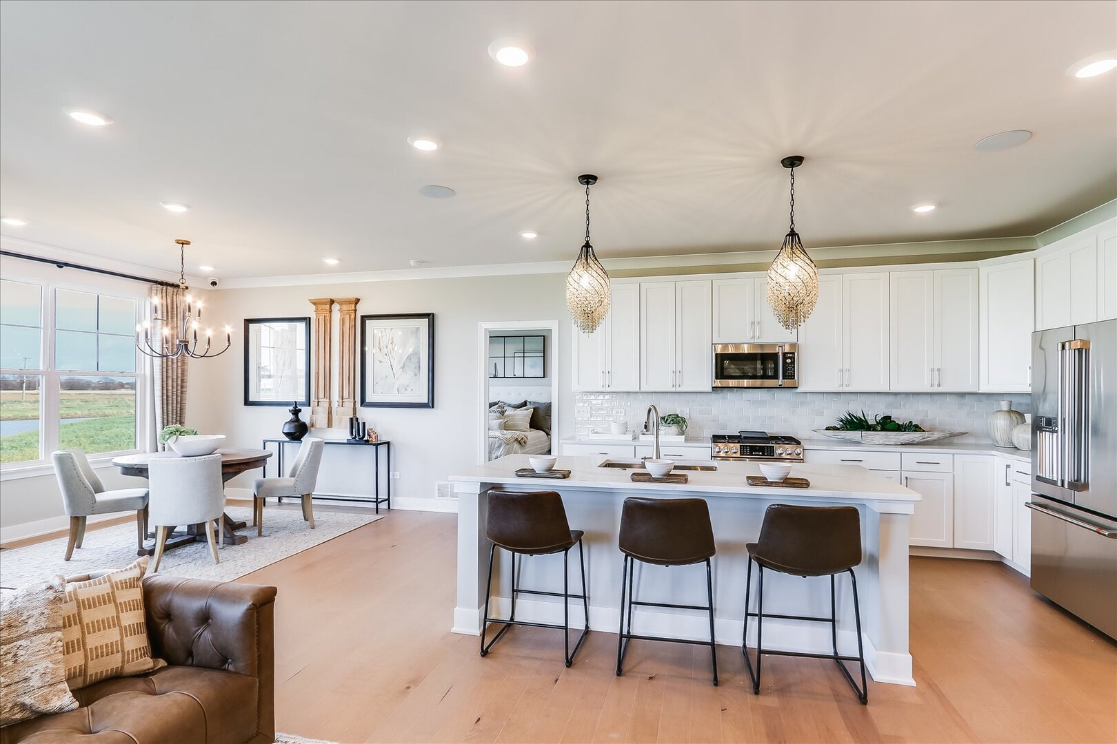 25531 West Alabaster Circle Plainfield, IL 60544 - Photo 11 of 31 a large kitchen with cabinets chairs and white appliances