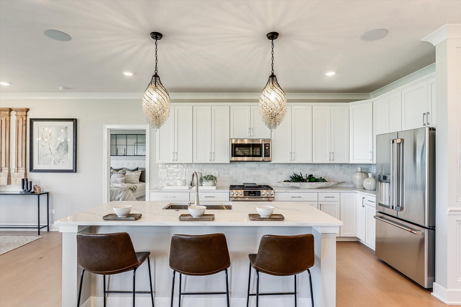 25531 West Alabaster Circle Plainfield, IL 60544 - Photo 13 of 31 a kitchen with stainless steel appliances granite countertop a sink a stove a refrigerator cabinets and chairs