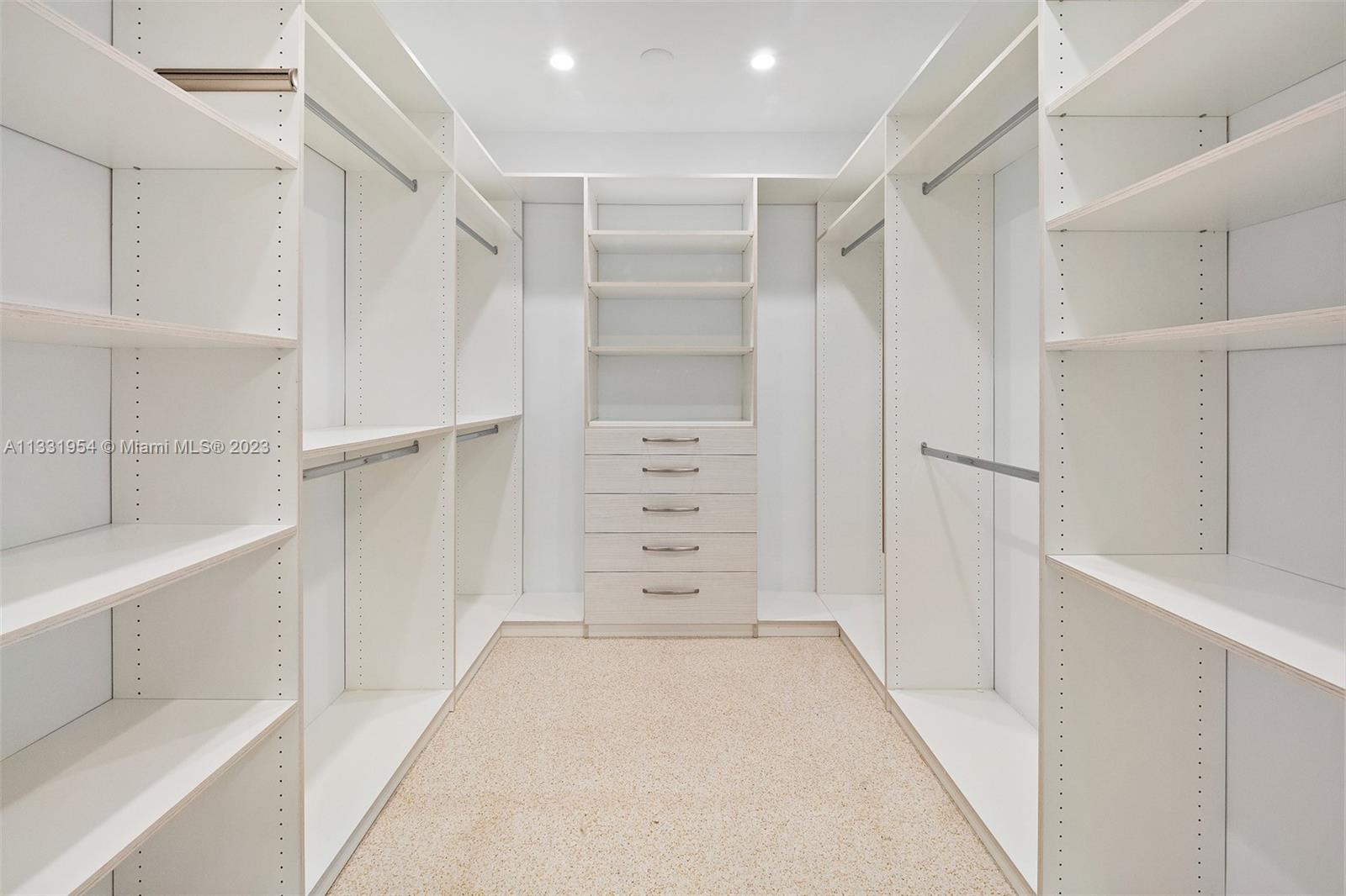 12050 Moss Ranch Road Pinecrest, FL 33156 - Photo 24 of 45 a view of walk in closet with empty racks