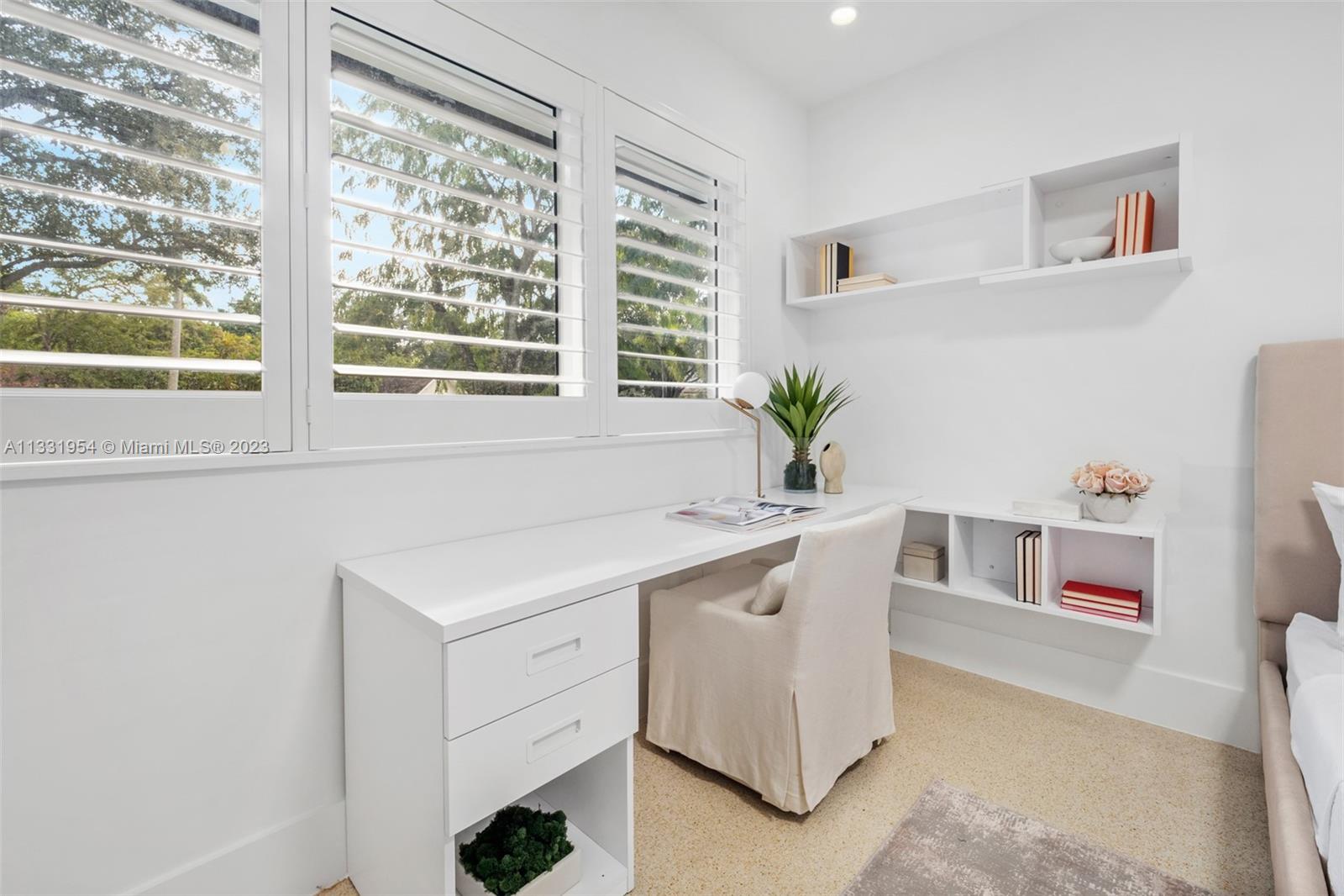 12050 Moss Ranch Road Pinecrest, FL 33156 - Photo 26 of 45 a white kitchen with a sink and large window