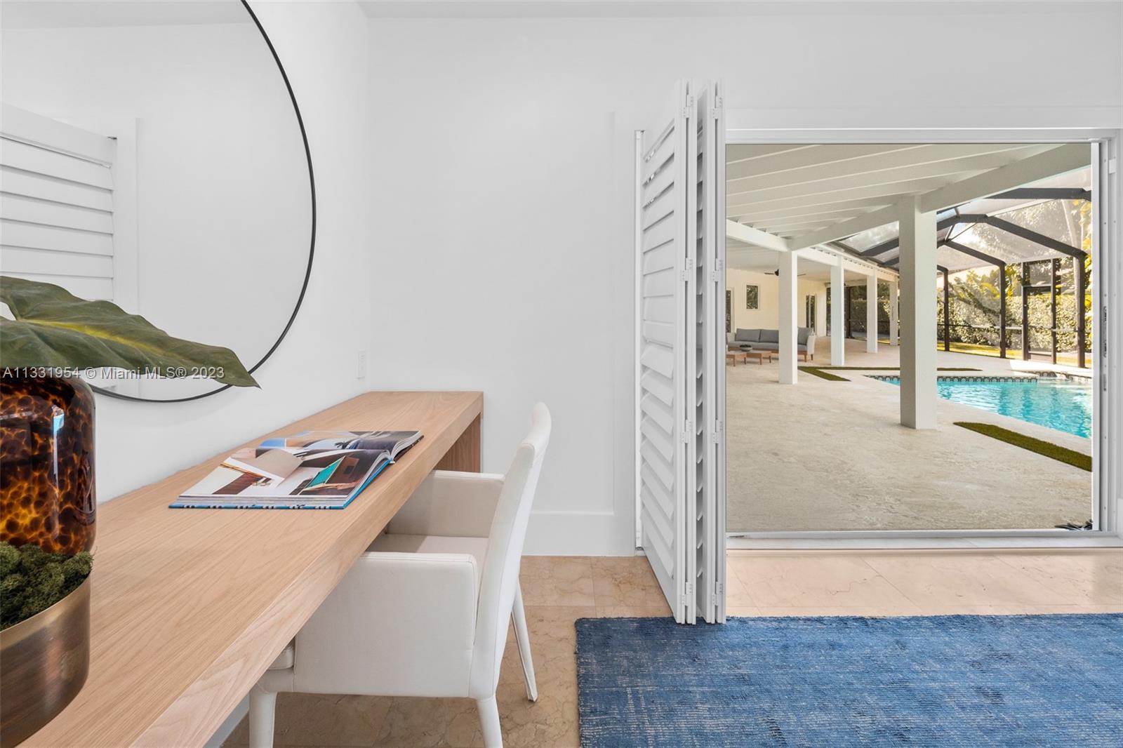 12050 Moss Ranch Road Pinecrest, FL 33156 - Photo 32 of 45 a view of living room with furniture and floor to ceiling window