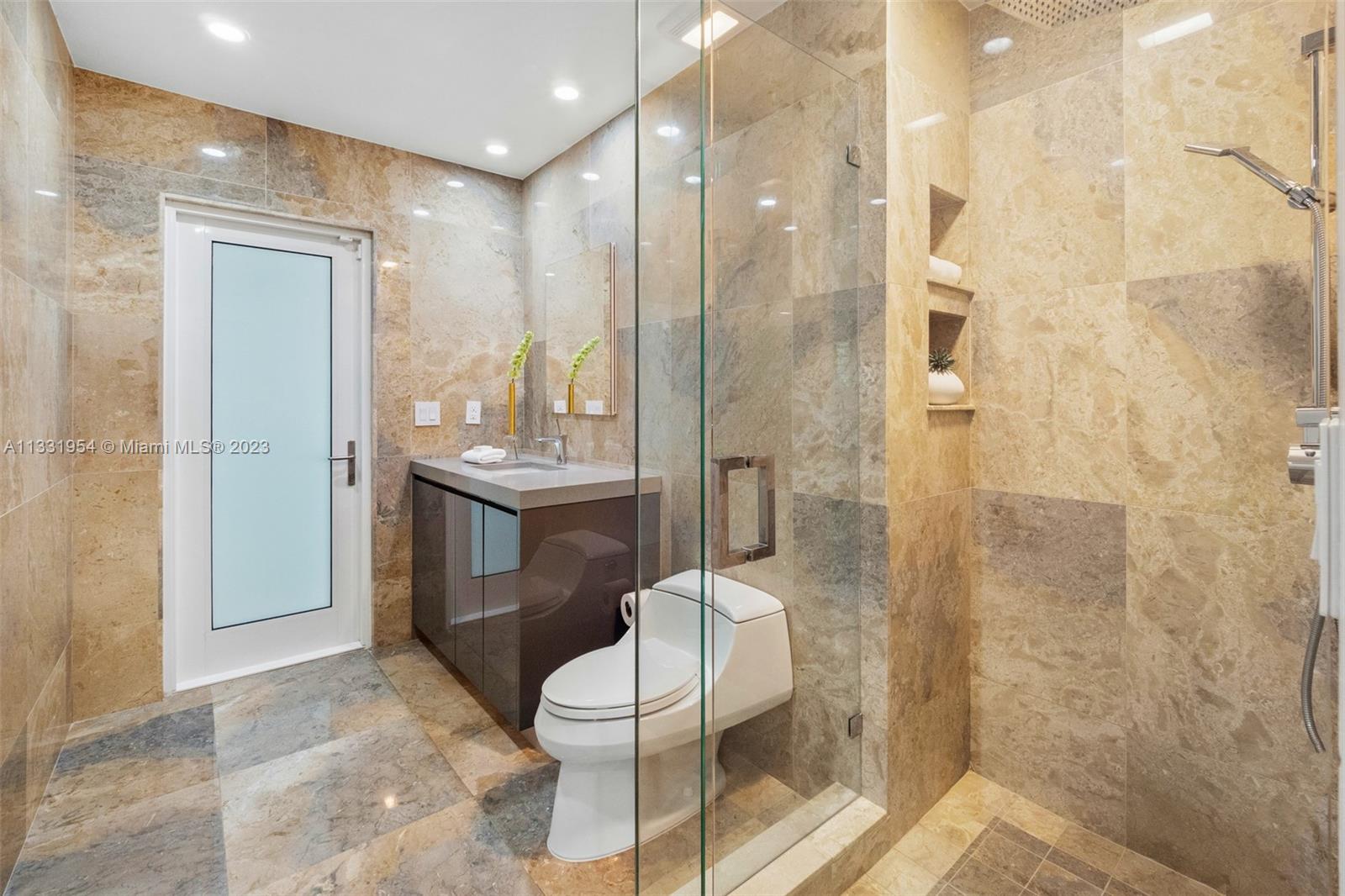 12050 Moss Ranch Road Pinecrest, FL 33156 - Photo 33 of 45 a bathroom with a sink toilet and shower