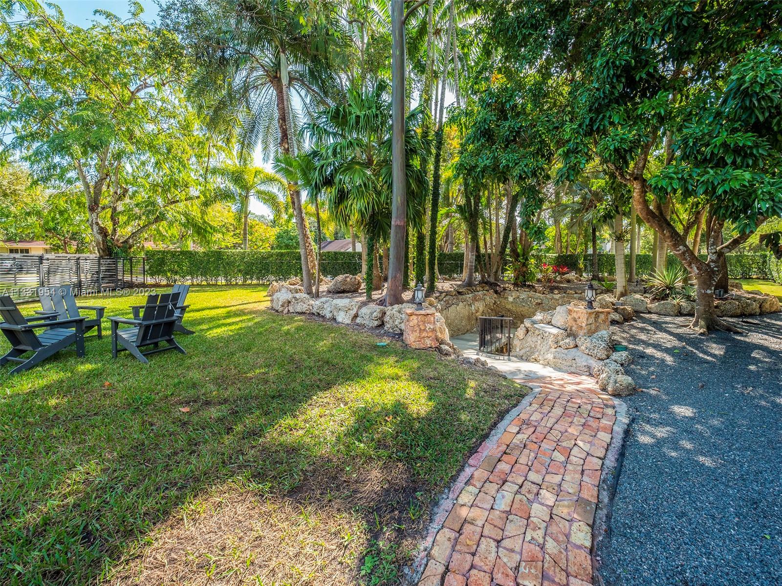 12050 Moss Ranch Road Pinecrest, FL 33156 - Photo 35 of 45 a view of a park with large trees