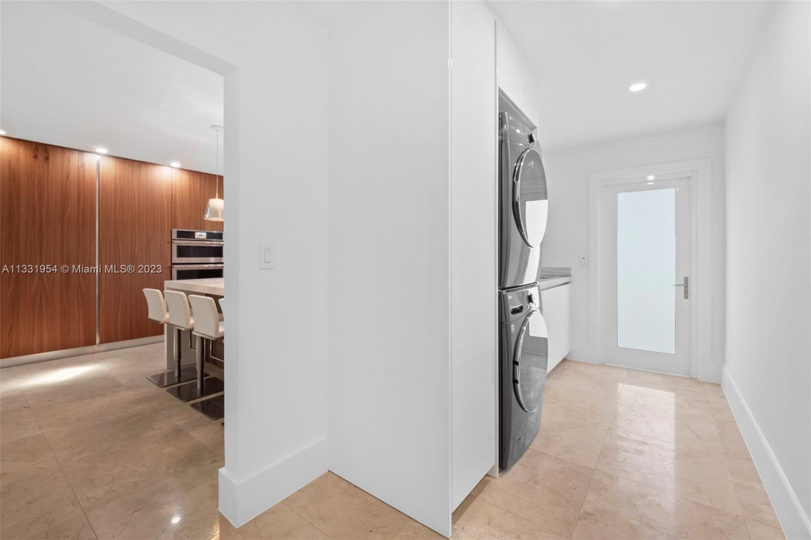 12050 Moss Ranch Road Pinecrest, FL 33156 - Photo 38 of 45 a view of a kitchen from a hallway