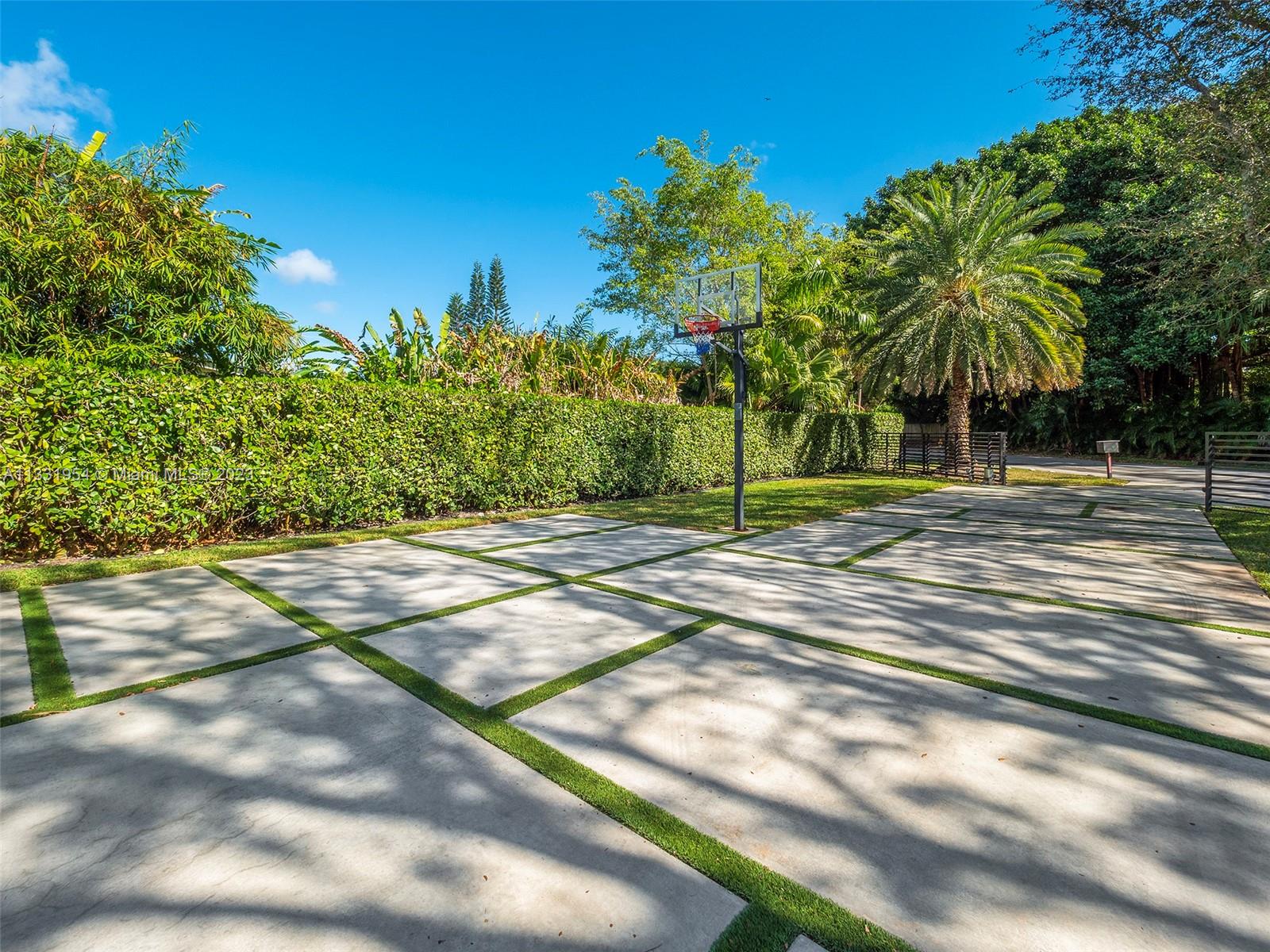 12050 Moss Ranch Road Pinecrest, FL 33156 - Photo 42 of 45 a view of a yard with a house