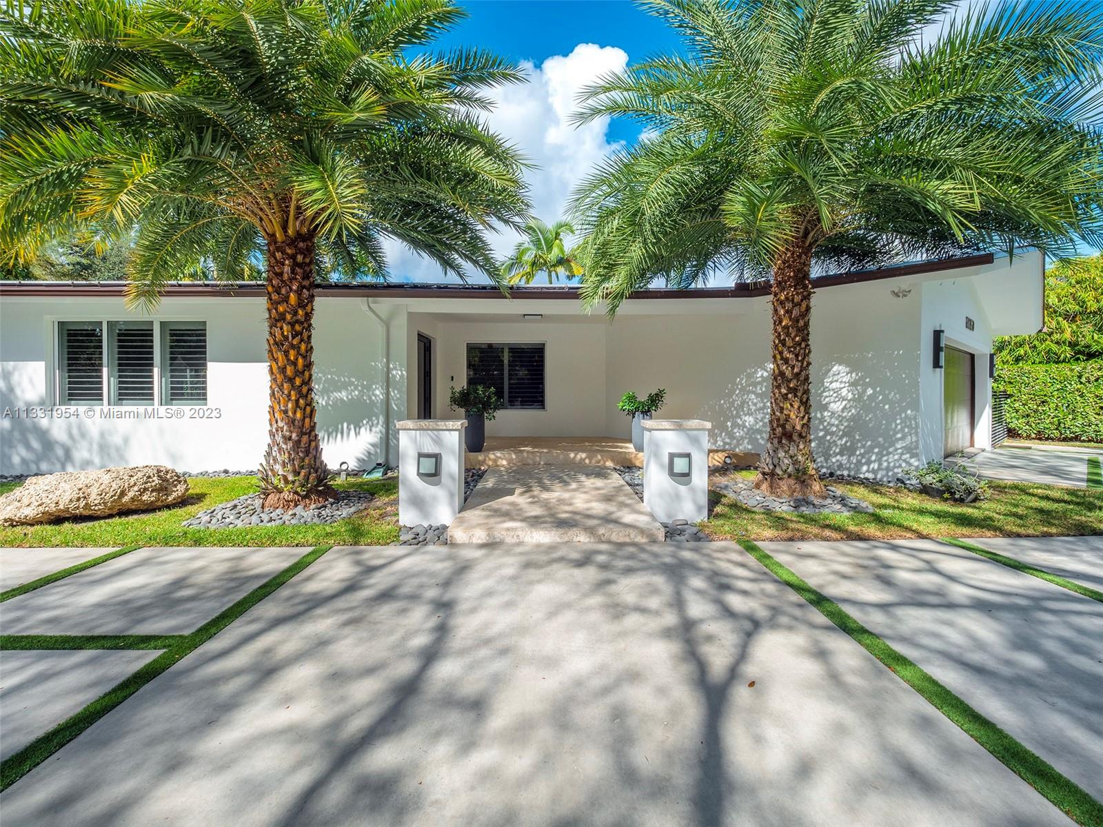 12050 Moss Ranch Road Pinecrest, FL 33156 - Photo 45 of 45 a view of a house with backyard and sitting area