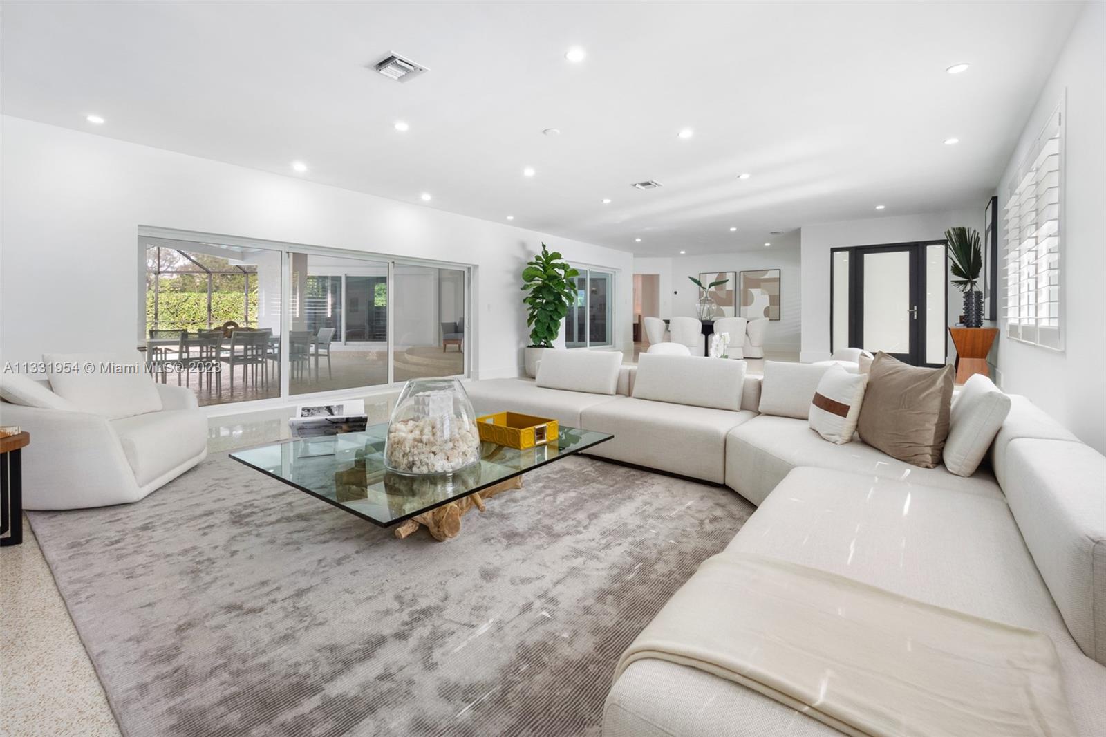 12050 Moss Ranch Road Pinecrest, FL 33156 - Photo 6 of 45 a living room with furniture and a couch
