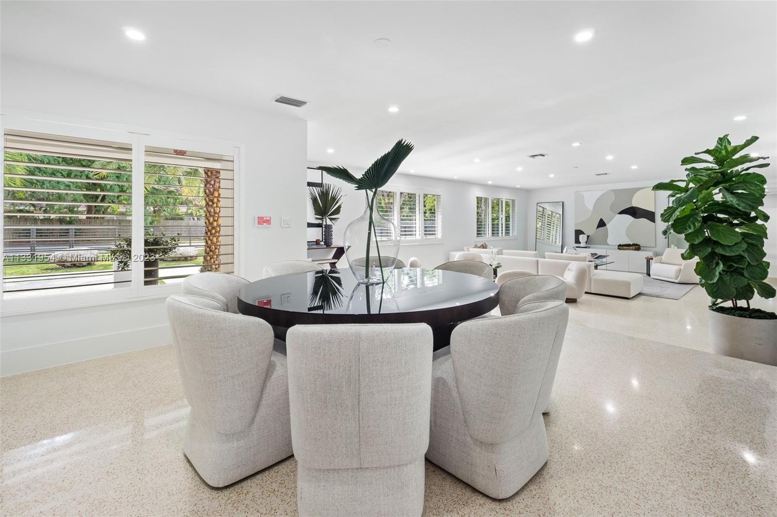 12050 Moss Ranch Road Pinecrest, FL 33156 - Photo 8 of 45 a living room with fireplace furniture and a potted plant