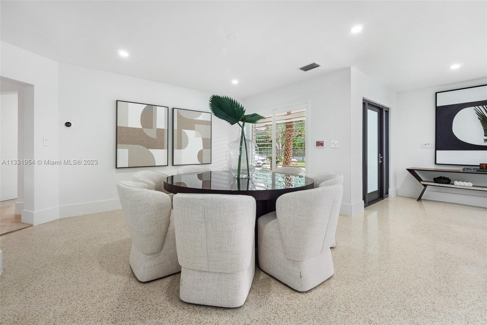 12050 Moss Ranch Road Pinecrest, FL 33156 - Photo 9 of 45 a living room with furniture and wooden floor