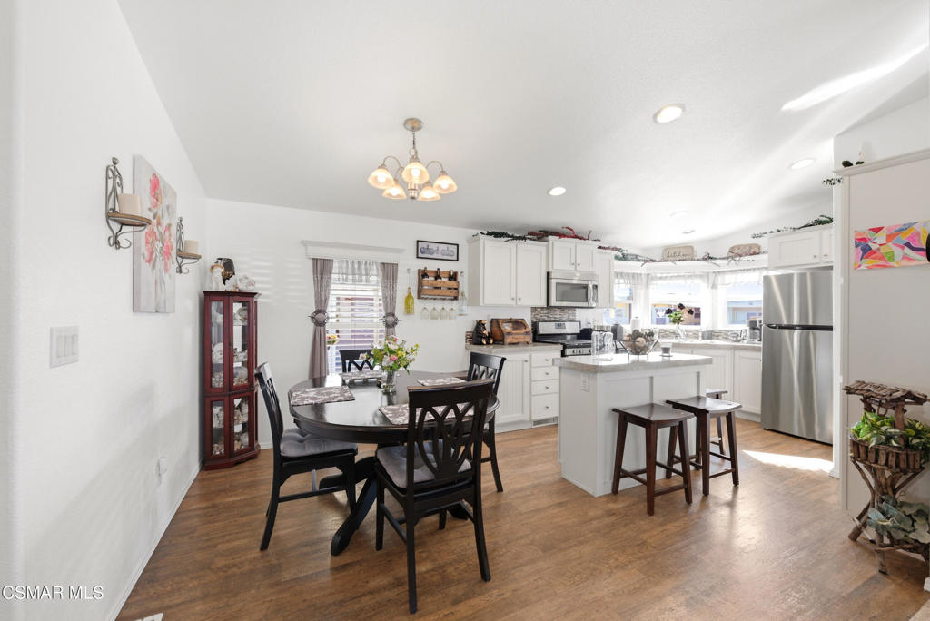 2167 Cardinal Avenue Oxnard, CA 93033 - Photo 15 of 36 a view of a dining room with furniture and wooden floor