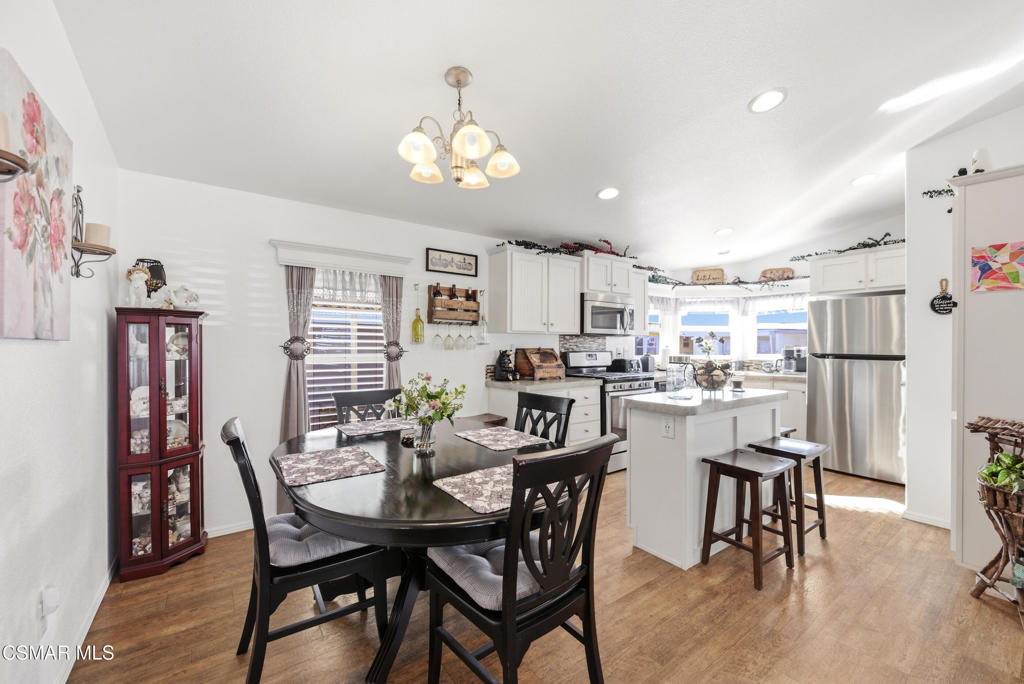 2167 Cardinal Avenue Oxnard, CA 93033 - Photo 16 of 36 a view of a dining room with furniture and chandelier