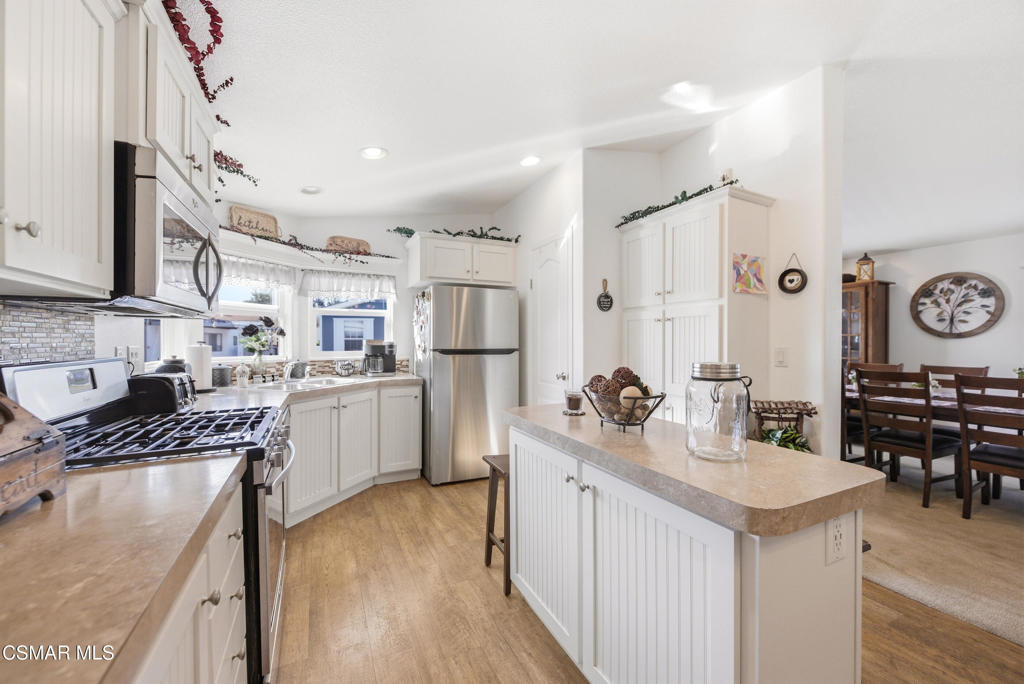 2167 Cardinal Avenue Oxnard, CA 93033 - Photo 18 of 36 a kitchen with a sink stove and refrigerator