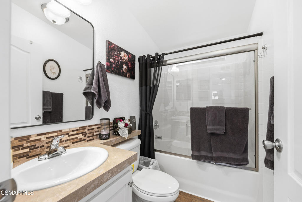 2167 Cardinal Avenue Oxnard, CA 93033 - Photo 23 of 36 a bathroom with a sink and a mirror