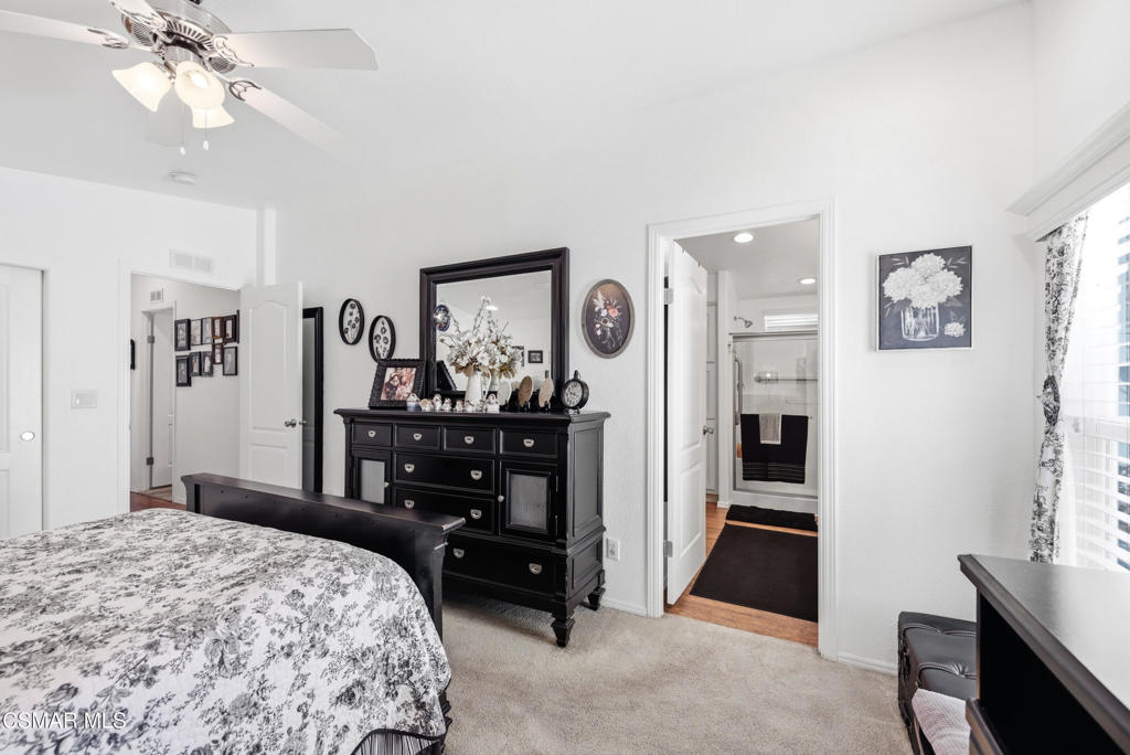 2167 Cardinal Avenue Oxnard, CA 93033 - Photo 25 of 36 a bedroom with a bed and a chandelier