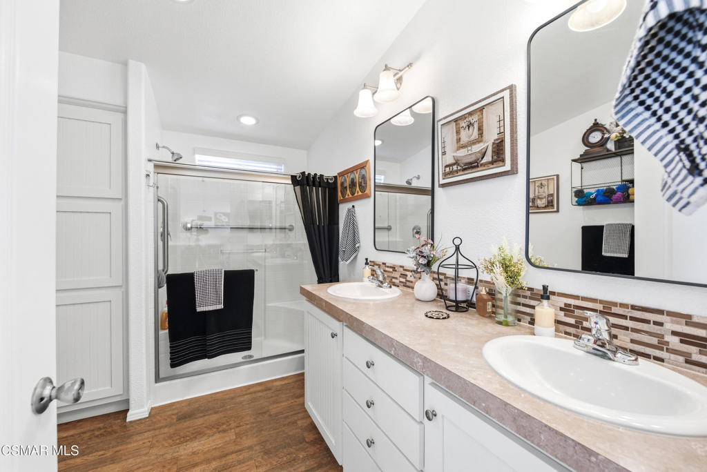 2167 Cardinal Avenue Oxnard, CA 93033 - Photo 26 of 36 a spacious bathroom with a sink double vanity and a mirror