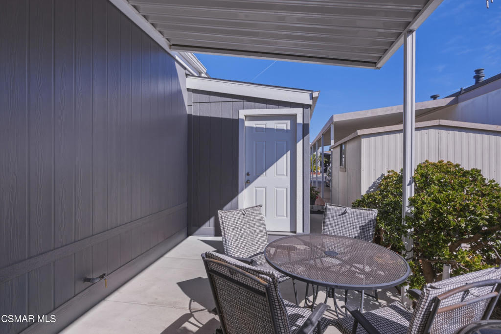 2167 Cardinal Avenue Oxnard, CA 93033 - Photo 32 of 36 a balcony with table and chairs