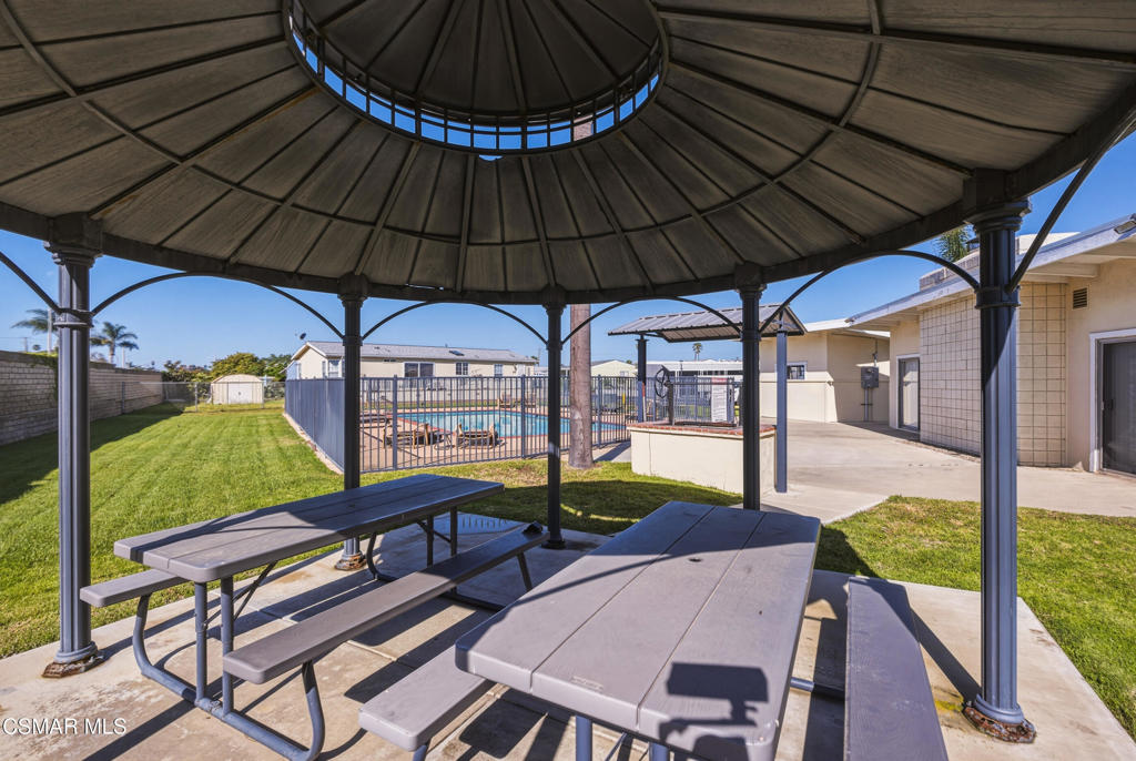 2167 Cardinal Avenue Oxnard, CA 93033 - Photo 34 of 36 a view of a patio with table and chairs under an umbrella