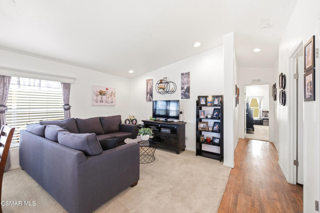 2167 Cardinal Avenue Oxnard, CA 93033 - Photo 10 of 36 a living room with furniture and a wooden floor