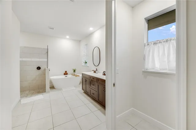 a spacious bathroom with a sink a toilet and shower