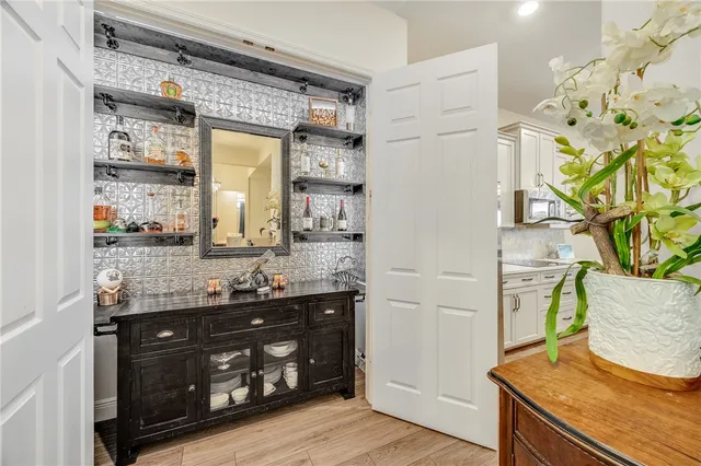 a bathroom with a granite countertop sink a mirror and a shower