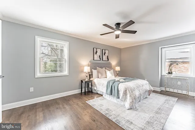 a bathroom with a double vanity sink mirror and shower